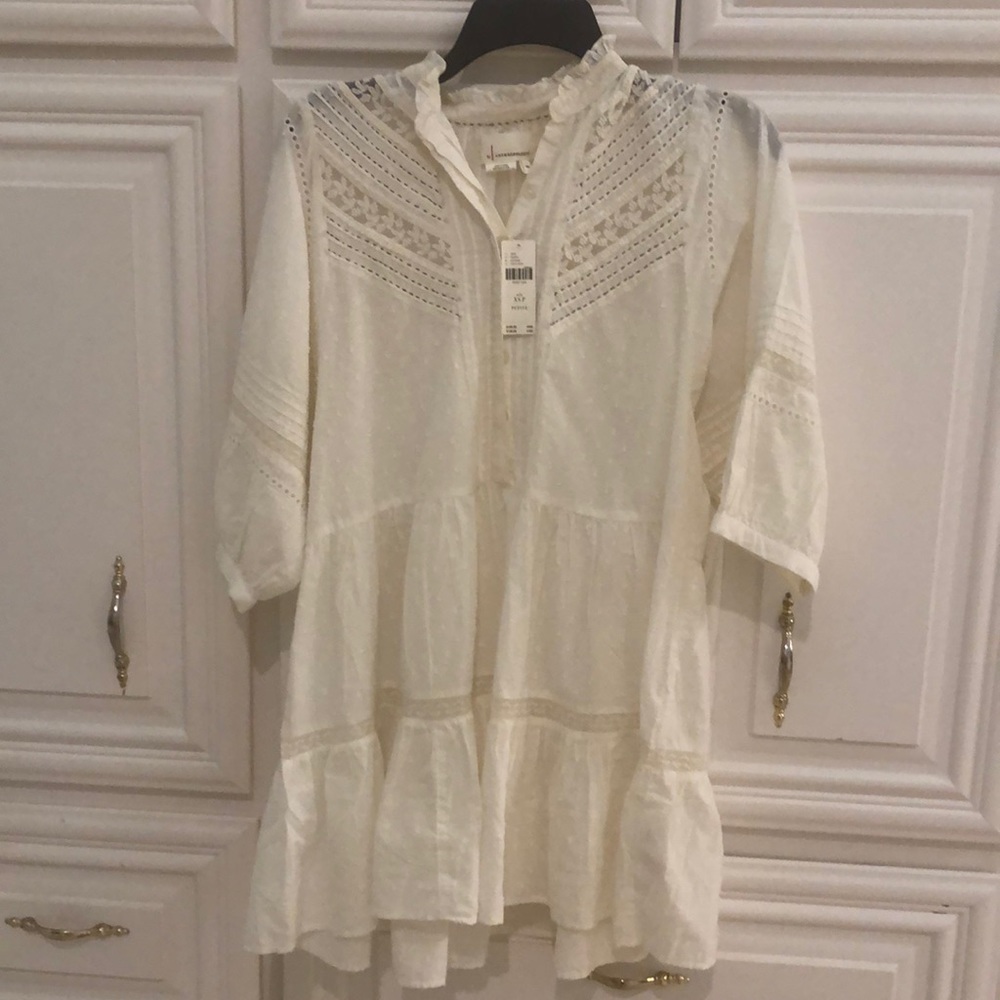 Brand new top for sale. It runs big
